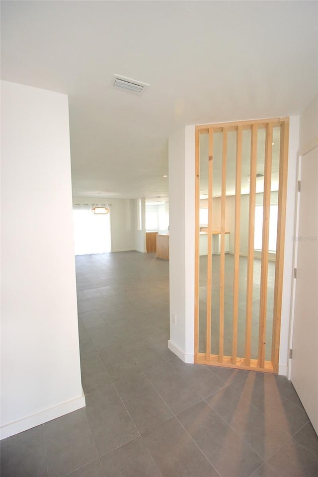 19 Cedarfield Ct, Palm Coast, FL 32137 - hall featuring dark tile patterned floors