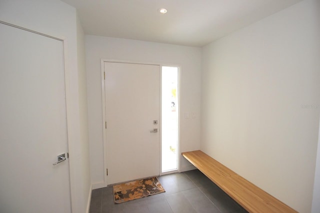 19 Cedarfield Ct, Palm Coast, FL 32137 - foyer entrance with dark tile patterned flooring and recessed lighting