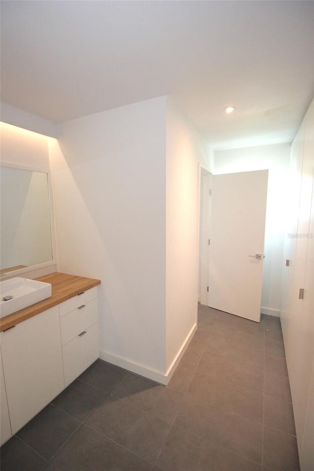 19 Cedarfield Ct, Palm Coast, FL 32137 - bathroom featuring vanity, tile patterned floors, recessed lighting, and baseboards