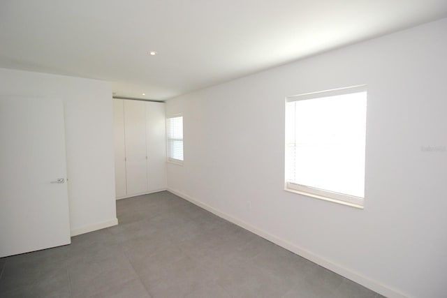 19 Cedarfield Ct, Palm Coast, FL 32137 - unfurnished bedroom featuring a closet, baseboards, and recessed lighting