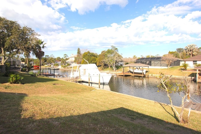 19 Cedarfield Ct, Palm Coast, FL 32137 - dock featuring a water view, a lawn, boat lift, and a residential view