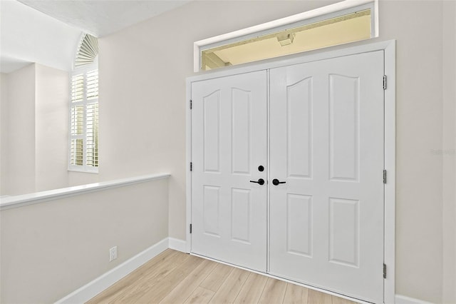 38 Kingsley Cir, Ormond Beach, FL 32174 - entrance foyer with baseboards and wood finished floors