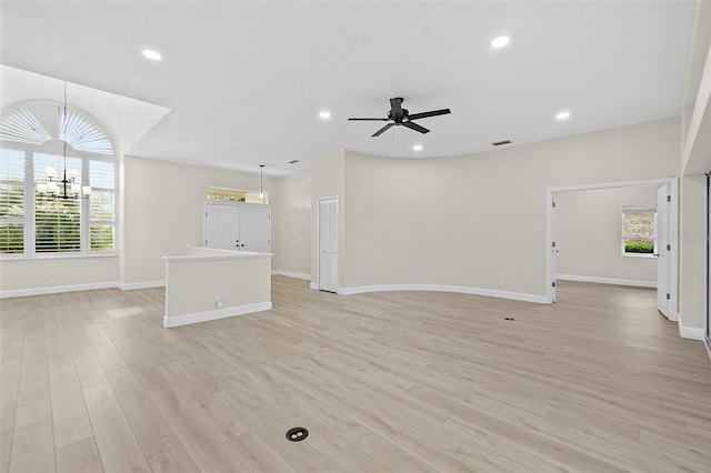 38 Kingsley Cir, Ormond Beach, FL 32174 - unfurnished living room with a chandelier, baseboards, recessed lighting, light wood finished floors, and ceiling fan