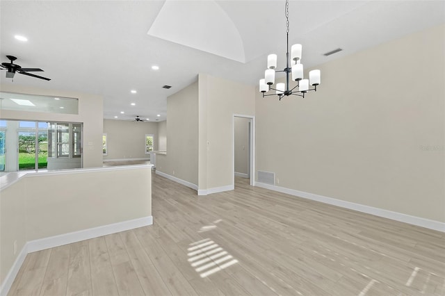 38 Kingsley Cir, Ormond Beach, FL 32174 - spare room featuring ceiling fan, light wood-type flooring, a chandelier, recessed lighting, and baseboards