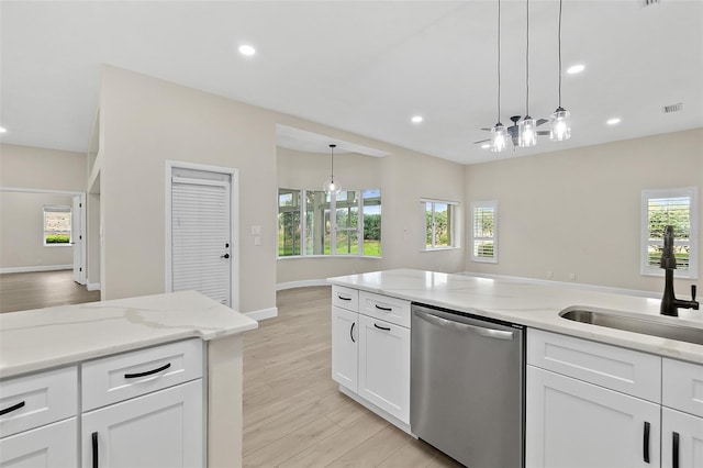 38 Kingsley Cir, Ormond Beach, FL 32174 - kitchen featuring dishwasher, recessed lighting, hanging light fixtures, white cabinetry, and light wood-style floors