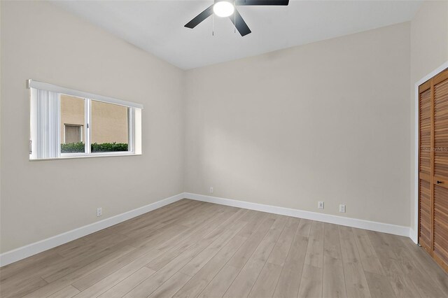 38 Kingsley Cir, Ormond Beach, FL 32174 - unfurnished bedroom featuring light wood finished floors, a closet, baseboards, and a ceiling fan