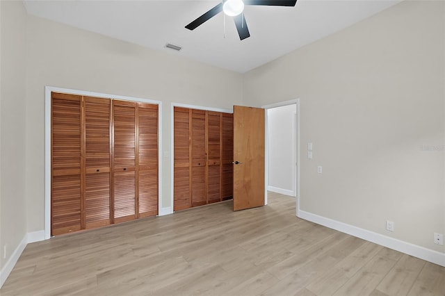 38 Kingsley Cir, Ormond Beach, FL 32174 - unfurnished bedroom featuring two closets, light wood-type flooring, and baseboards