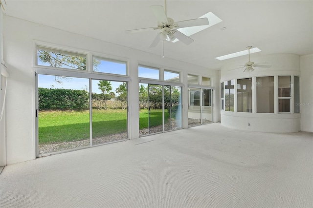 38 Kingsley Cir, Ormond Beach, FL 32174 - unfurnished sunroom featuring a ceiling fan, a skylight, and carpet flooring