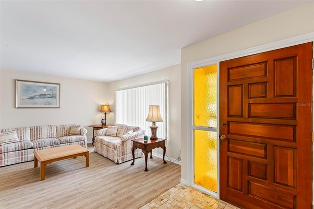 179 Frankford Ln, Palm Coast, FL 32137 - living room featuring baseboards and light wood-type flooring