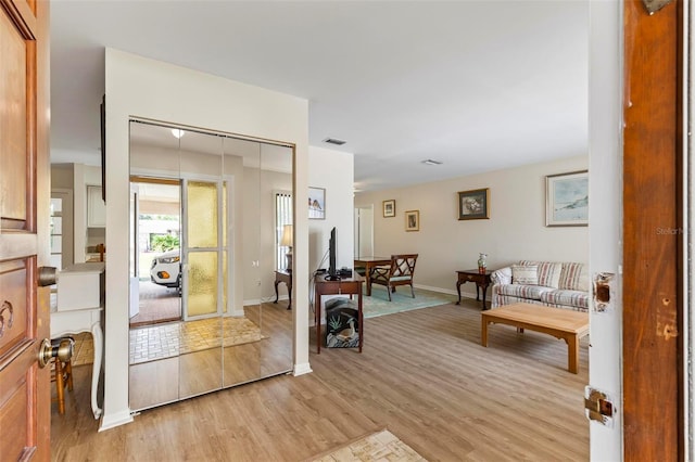 179 Frankford Ln, Palm Coast, FL 32137 - foyer with light wood-style floors and baseboards