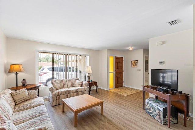 179 Frankford Ln, Palm Coast, FL 32137 - living room featuring light wood-style floors and baseboards