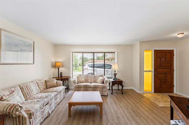179 Frankford Ln, Palm Coast, FL 32137 - living area featuring light wood-style flooring and baseboards