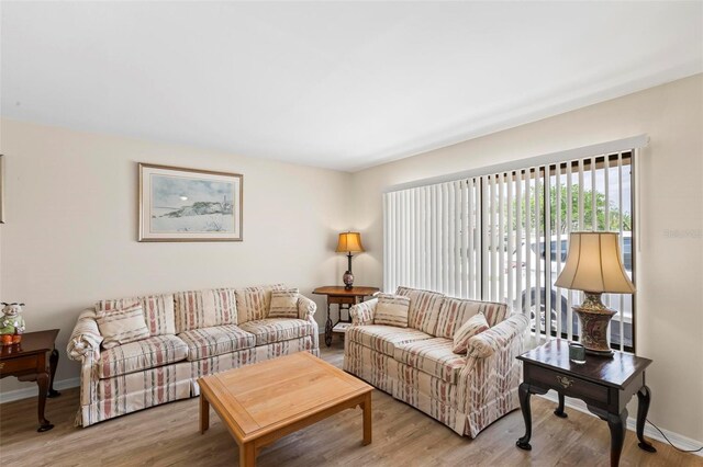 179 Frankford Ln, Palm Coast, FL 32137 - living area featuring light wood-style floors and baseboards