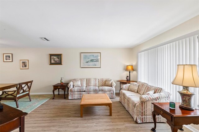 179 Frankford Ln, Palm Coast, FL 32137 - living area featuring light wood-style flooring and baseboards