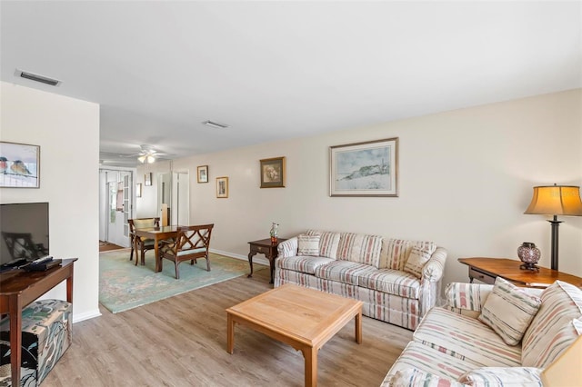 179 Frankford Ln, Palm Coast, FL 32137 - living area with light wood-style floors, baseboards, and a ceiling fan