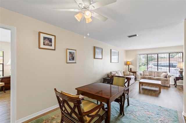 179 Frankford Ln, Palm Coast, FL 32137 - dining space with wood finished floors, ceiling fan, and baseboards