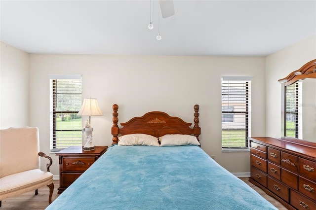 179 Frankford Ln, Palm Coast, FL 32137 - bedroom featuring baseboards, a ceiling fan, and wood finished floors