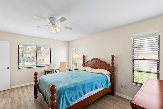 179 Frankford Ln, Palm Coast, FL 32137 - bedroom with light wood-style flooring, baseboards, and a ceiling fan
