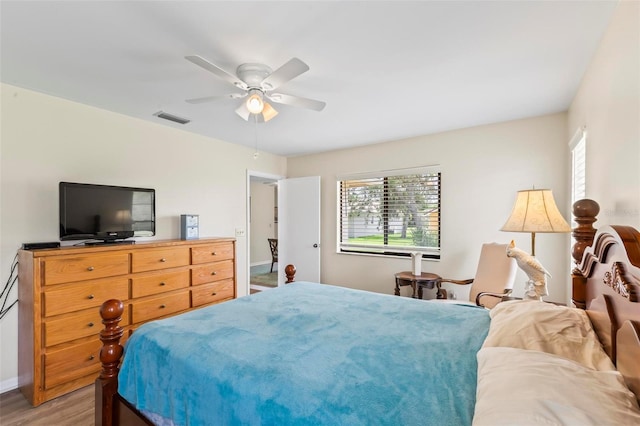 179 Frankford Ln, Palm Coast, FL 32137 - bedroom with baseboards, light wood-type flooring, and ceiling fan