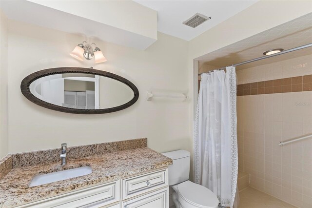 179 Frankford Ln, Palm Coast, FL 32137 - bathroom with toilet, vanity, and tiled shower