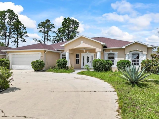 42 Raintree Pl, Palm Coast, FL 32164 - ranch-style home with stucco siding, driveway, and a garage