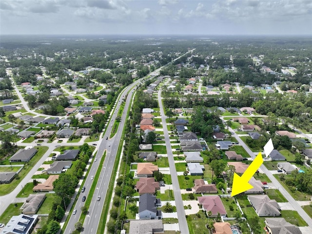 42 Raintree Pl, Palm Coast, FL 32164 - aerial view of property and surrounding area featuring nearby suburban area and a main thoroughfare