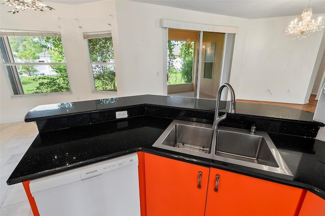 42 Raintree Pl, Palm Coast, FL 32164 - kitchen with dishwasher, a chandelier, plenty of natural light, and a sink
