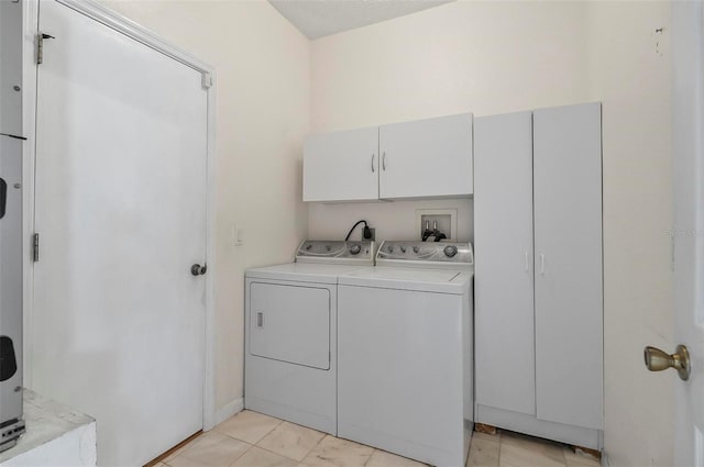42 Raintree Pl, Palm Coast, FL 32164 - laundry area featuring cabinet space and separate washer and dryer
