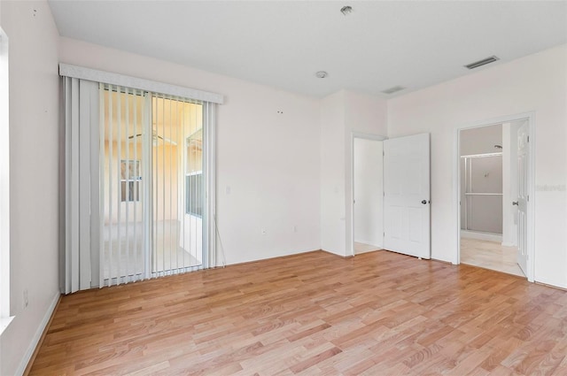 42 Raintree Pl, Palm Coast, FL 32164 - empty room featuring light wood-type flooring and fire sprinkler in ceiling