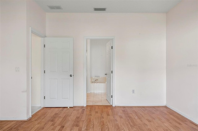 42 Raintree Pl, Palm Coast, FL 32164 - empty room with light wood-type flooring and baseboards