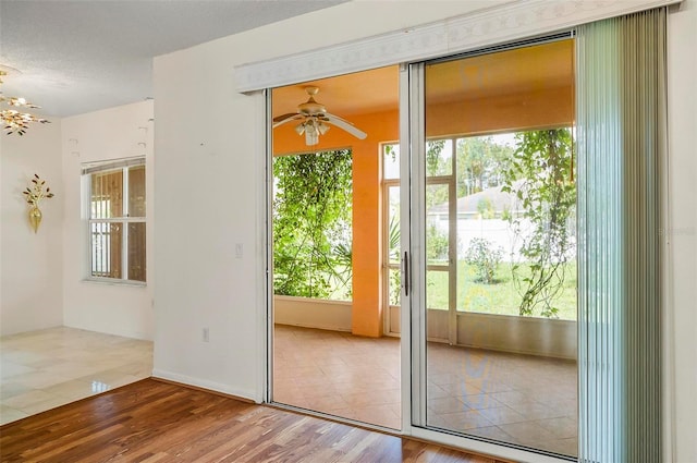 42 Raintree Pl, Palm Coast, FL 32164 - entryway with healthy amount of natural light, ceiling fan, and wood finished floors