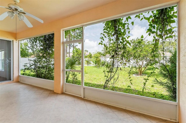 42 Raintree Pl, Palm Coast, FL 32164 - unfurnished sunroom featuring ceiling fan and tile patterned flooring