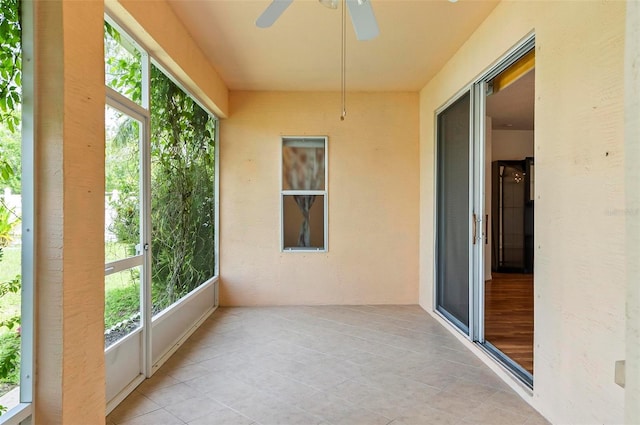 42 Raintree Pl, Palm Coast, FL 32164 - unfurnished sunroom featuring plenty of natural light and tile patterned flooring
