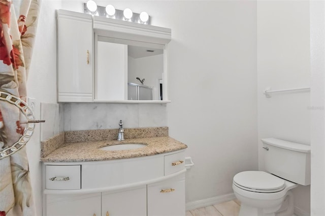 42 Raintree Pl, Palm Coast, FL 32164 - bathroom with vanity, toilet, tile patterned floors, and baseboards