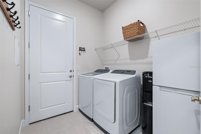 17 Newhaven Ln, Ormond Beach, FL 32174 - washroom with independent washer and dryer and light tile patterned floors