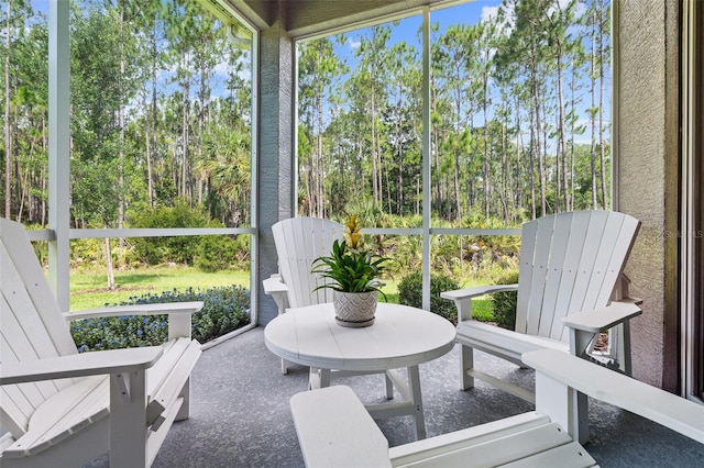 17 Newhaven Ln, Ormond Beach, FL 32174 - sunroom / solarium featuring view of scattered trees