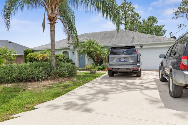 85 Sloganeer Trl, Palm Coast, FL 32164 - ranch-style house featuring a garage, driveway, a shingled roof, and stucco siding