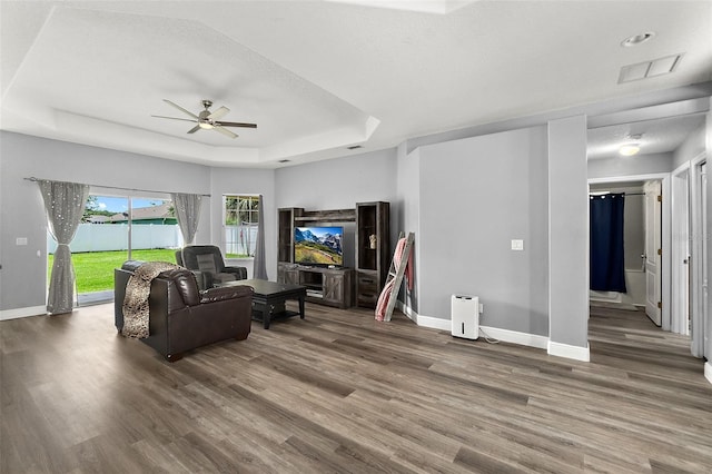4 Seathorn Path, Palm Coast, FL 32164 - living area with a raised ceiling, a ceiling fan, and wood finished floors