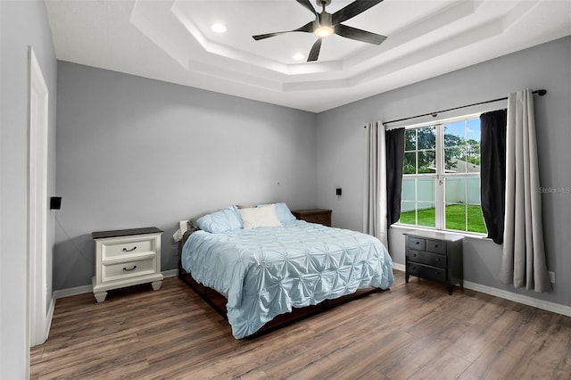 4 Seathorn Path, Palm Coast, FL 32164 - bedroom with a raised ceiling, wood finished floors, recessed lighting, and a ceiling fan