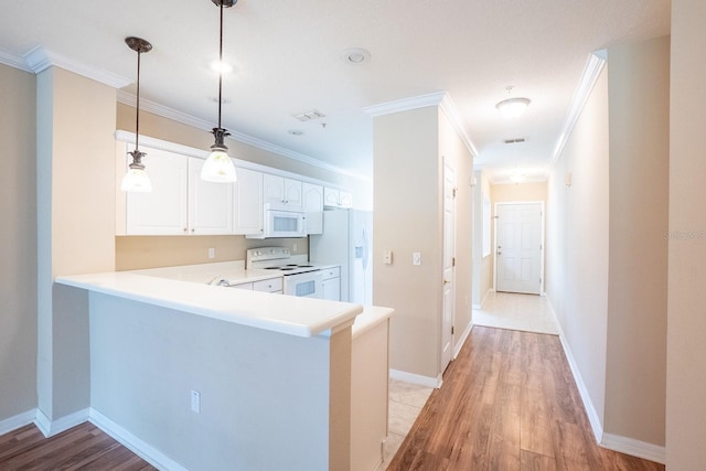 1400 Canopy Walk Ln Unit 1413, Palm Coast, FL 32137 - kitchen featuring white appliances, crown molding, light countertops, light wood-type flooring, and white cabinetry