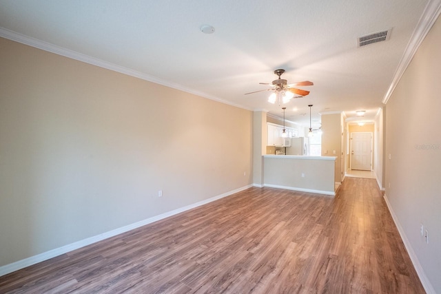 1400 Canopy Walk Ln Unit 1413, Palm Coast, FL 32137 - unfurnished living room featuring a ceiling fan, wood finished floors, and crown molding