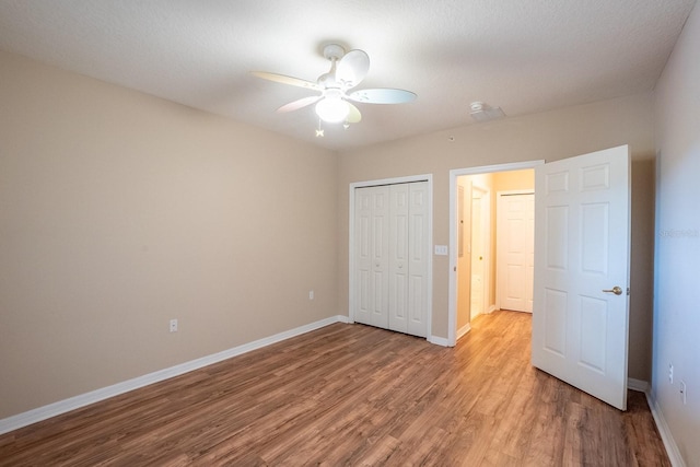 1400 Canopy Walk Ln Unit 1413, Palm Coast, FL 32137 - unfurnished bedroom with light wood-style flooring, a closet, and a ceiling fan