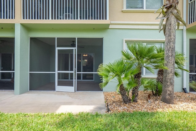 1400 Canopy Walk Ln Unit 1413, Palm Coast, FL 32137 - entrance to property featuring stucco siding and a patio area