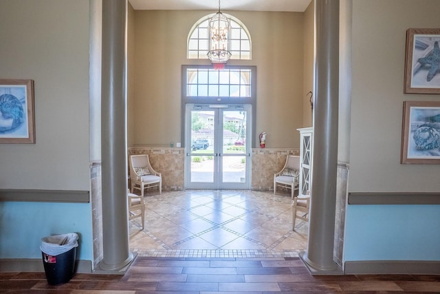1400 Canopy Walk Ln Unit 1413, Palm Coast, FL 32137 - foyer with ornate columns, healthy amount of natural light, french doors, a chandelier, and a towering ceiling
