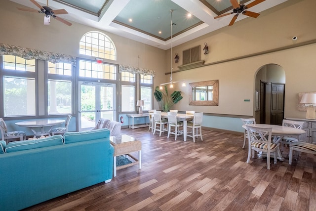 1400 Canopy Walk Ln Unit 1413, Palm Coast, FL 32137 - living area with ceiling fan, a high ceiling, coffered ceiling, wood finished floors, and arched walkways