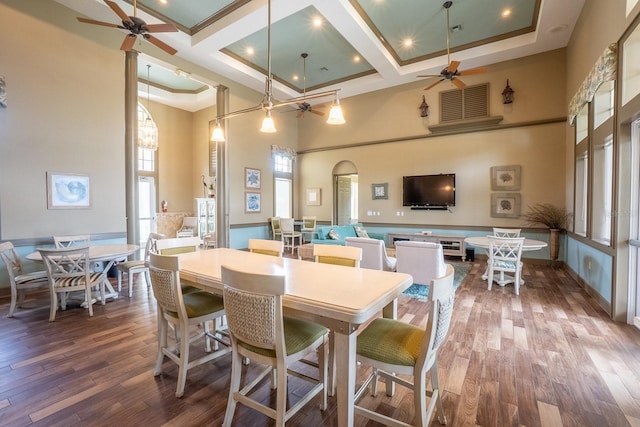 1400 Canopy Walk Ln Unit 1413, Palm Coast, FL 32137 - dining space with ceiling fan, a high ceiling, wood finished floors, coffered ceiling, and beamed ceiling