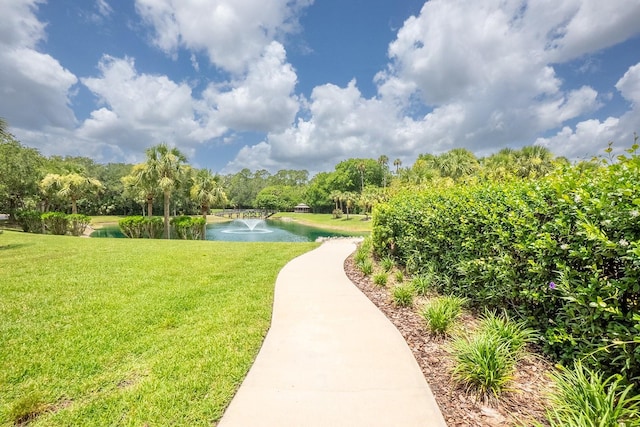 1400 Canopy Walk Ln Unit 1413, Palm Coast, FL 32137 - view of community with a water view and a yard