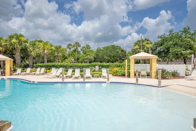 1400 Canopy Walk Ln Unit 1413, Palm Coast, FL 32137 - community pool featuring a gazebo, a patio, and view of wooded area