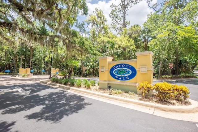 1400 Canopy Walk Ln Unit 1413, Palm Coast, FL 32137 - community / neighborhood sign with view of wooded area