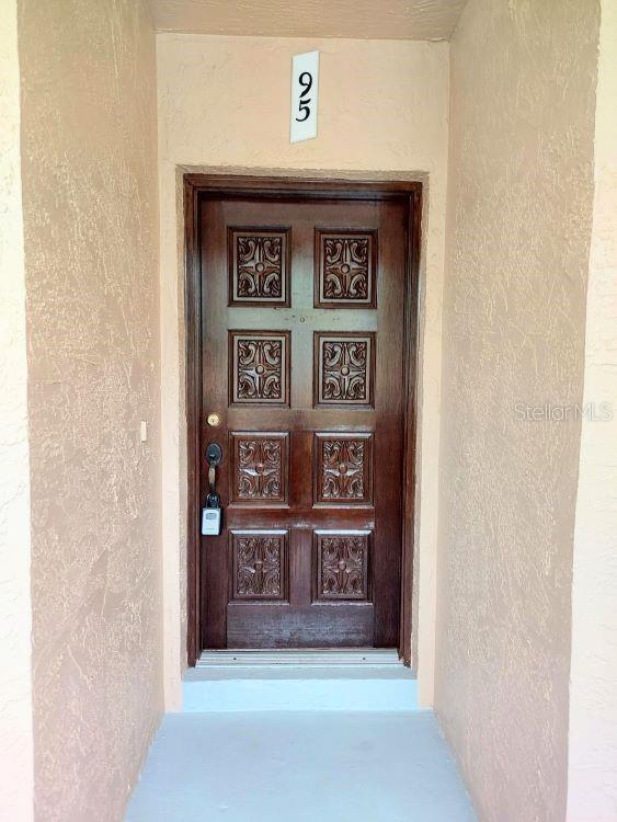 95 Rivers Edge Ln Unit 95, Palm Coast, FL 32137 - view of exterior entry with stucco siding